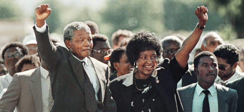 Photo of Nelson Mandela with his arm raised