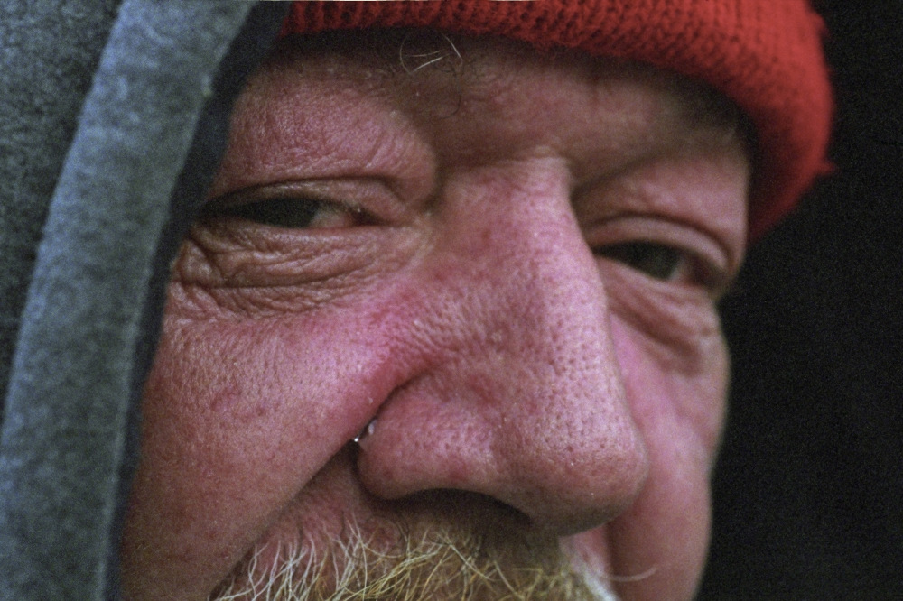 Homeless man with a tear in his eye